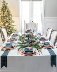 A gilded pinecone and an antler motif add organic elegance. A Simple And Beautiful Holiday Table Setting Sanctuary Home Decor