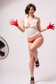 Short haired beauty Michela exposes her curvy figure in red panties and  gloves
