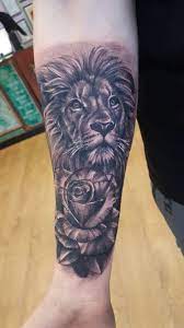 The artwork speaks for itself. Lion And Rose Tattoo On Forearm Lion And Rose Tattoo Rose Tattoo Forearm Lion Tattoo Sleeves
