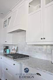 This quaint kitchen expands itself with the use of white cabinets and matching fridge doors. Should You Really Paint Your Kitchen Cabinets White And Which White Is Best Kylie M Interiors