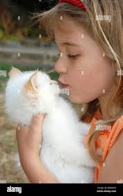 Five year old girl with pet rabbit Georgia Starkey model released Stock  Photo