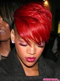 Rihanna wears her strawberry blonde pixie cut straight and layered. Rihanna Short Red Hair With Shaved Undercut Short Hair Styles Short Red Hair Rihanna Red Hair