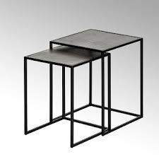 The table and base of the ottomans are crafted with wood solids in a neutral gray finish. Side Tables Coffee Tables