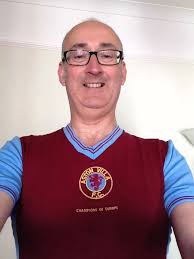 Aston Villa fans in their claret and blue kits