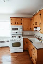 For our diy kitchen remodel (see before and after here), we knew we wanted mostly white kitchen cabinets with an accent color kitchen island. Kitchen Before After How I Painted My Kitchen Cabinets White