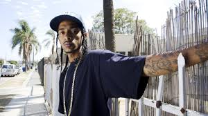 Related nipsey hussle blue wallpaper. Nipsey Hussle Is Wearing Blue Tshirt Having Tattoos In Hand Standing In Front Of Gate Hd Music Wallpapers Hd Wallpapers Id 38457