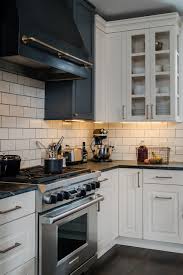 Huge custom kitchen with attached chef kitchen. Black Kitchen Hood Transitional Kitchen Bay Cabinetry