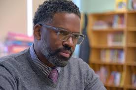 This Baltimore man aims to boost students' confidence and grades, one pair  of sneakers at a time