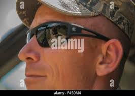 Tech. Sgt. Caleb Brown of the 130th Airlift Wing, McLaughlin Air National  Guard Base, W.Va., shovels mud and debris during flood cleanup