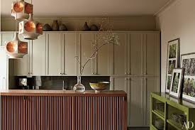 A light wood brown and white makes for a great earthy and bright kitchen. Painted Kitchen Cabinet Ideas Architectural Digest