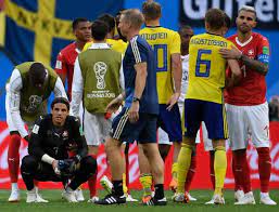 Switzerland S Midfielder Valon Behrami Congratulates Sweden S Players Next To Switzerland S Goalkeeper Yann Sommer At The End Of Midfielder Players Goalkeeper
