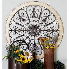 Find a wall shelf that will complement home decor be it modern, traditional, farmhouse, or bohemian. Harper Willow 36 In Large Round Distressed White Wood Metal Wall Decor With Tudor Rose And Scrollwork 52734 At Tractor Supply Co