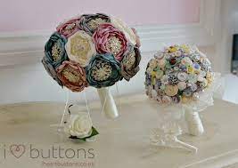 A bucolic wedding setting is made all the more lovely with this anemone, peony, ranunculus, olive, ruscus, and freesia bouquet created by amy burke designs. Wedding Bouquet Stand I Heart Buttons