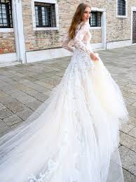 The designer uses silky charmeuse, tulle, chantilly lace, and bladed lace for her collection. Bliss Monique Lhuillier Wedding Dresses From Bridal Fashion Week