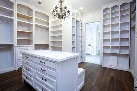 Drawers in glass or wood, open compartments, glass top and leather pocket emptier. Closet Island With Drop Down Bench Transitional Closet Closet Island Closet Designs Walk In Closet