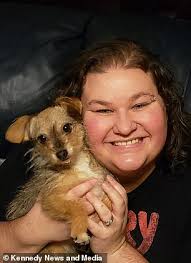 Ingenious dog owner customises old T-shirt to help clip her claws