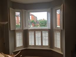 Before After Of The First Of Two Planation Shutters Installs In Manchester A Large 3 Sided Bay Window Fitted With Hard Grey Walls Window Fitting Bay Window