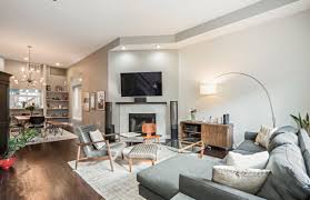 Modern Open Concept Living And Dining Room With A Retro Chandelier Recessed Lighting Living Room Remodel Contemporary Apartment Decor Contemporary Apartment