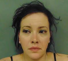 Illinois woman arrested after being found passed out behind the wheel