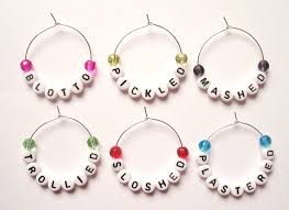 Each have a slice of cork and glass beads. Novelty Name Wine Glass Charms Cc1247