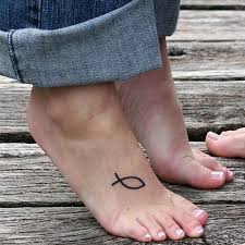 Woman With Jesus Fish Tattoo On Foot Foot Tattoo Foot Tattoos Tattoos For Women
