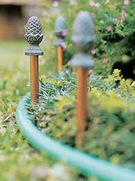 Pineapple Hose Guides Garden Hose Holder Backyard Landscaping Designs Landscaping Around House