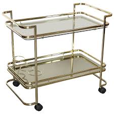 There are always those projects that get filtered back in my rooms. Gold Metal Glass And Mirror Two Tier Bar Tea Cart Or Serving Cart At 1stdibs