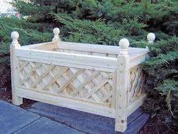 This durable black plastic plant container can hold and grow flowers and is maintenance free! Cedar Rectangle Lattice Planter