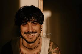 1,614 likes · 1 talking about this. Young Stylish Guy With Mustache And Tattoos In White Tank Top Looking In Camera Hipster Man Stock Photo 341415756