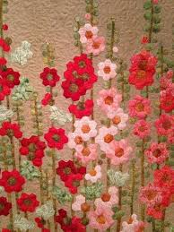These Hexie Flowers Make The Perfect Wall Hanging Fabric Flowers Hexies Applique English Paper Piecing Quilts Hexagon Quilt Pattern Hexie Quilts Patterns