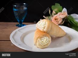 Place the pastry strips on a baking sheet lined with parchment paper and bake for 20 minutes or until puffed and golden; Two Cream Horns Pastry Image Photo Free Trial Bigstock