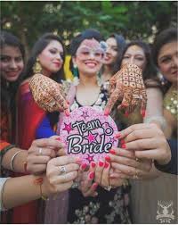 How To Flaunt You Re From The Bride S Side Trending Squad Accessories We Spotted At Indian Weddings For The Team Bride Witty Vows Bridesmaid Photoshoot Indian Wedding Photography Poses Bride Friend
