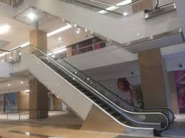 Escalator Cladding Sides And Soffit With Back Painted Glass Led Lighting On Soffit Steel Cladding Cladding Steel Columns