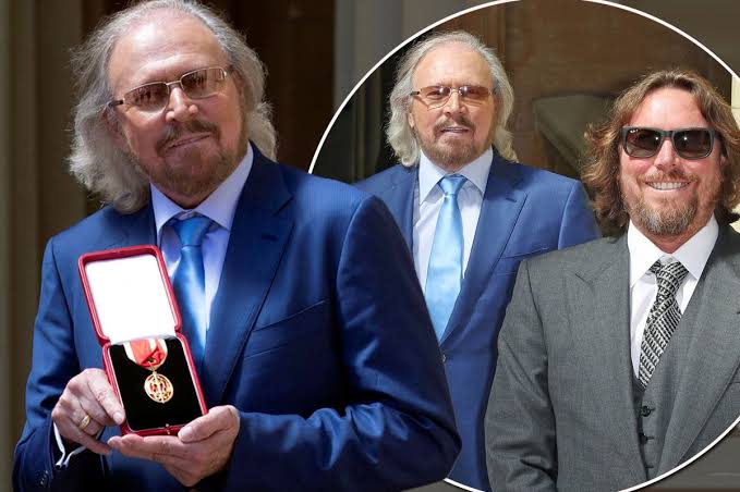 Barry Gibb beams with pride as he's knighted at Buckingham Palace - with  lookalike son watching on - Irish Mirror