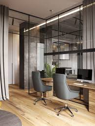 It's time to organise your home office and make it a joy to work in. A Glass Wall Separates The Living Room From The Home Office In This Modern Loft Apartment Modern Office Interiors Modern Loft Apartment Modern Office Design