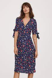 Long sleeve navy blue dress with floral pattern in the center knee length. Dark Blue Floral Premium Quality Knee Length Dress In Silk With A Printed Pattern V Neck And Buttons At Front Shor City Dress Casual Frocks Elegant Dresses
