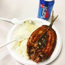 bangus fried milk fish over rice with vinegar sauce and a can of sarsi for lunch from our neighbor chaaste family market here in fried milk pinoy food lunch