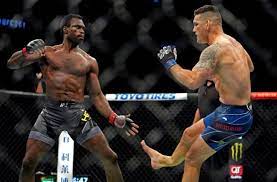 Chris weidman (blue gloves) breaks his leg on a kick to the legs of uriah hall (red gloves) during ufc. 5mltfcwmpcgcmm