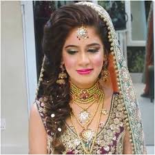 This bride opted for a hairstyle for her lehenga which is unique in so many ways. Latest Hairstyles That Suits All Types Of Sarees Lehengas