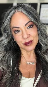 What Letting Your Gray Hair Grow Out Really Says About You Check in comment