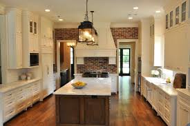 Source Luxe Living Interiors Exposed Brick Walls Floor To Ceiling White Shaker Kitchen Cabinets Espresso Stained Ki Home Brick Kitchen White Shaker Kitchen