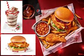 Kids sitting at christmas table with father. Kfc Offering A Special Christmas Dinner Box In The Uk