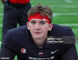 Defensive back Johnathan Baldwin of the UNLV Rebels is tackled by... News  Photo