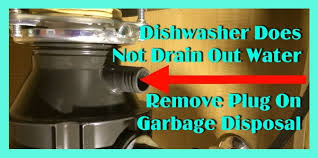 Remove the metal plate on the bottom of the garbage disposal. New Dishwasher Does Not Drain Out Water