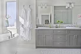 You will also notice that the material used on the island is featured on the backsplash which helps unify the entire look. Neutral To Sell Your Home But Color To Live In It Realty Times Grey Bathroom Cabinets Veranda Interiors Grey Bathrooms Designs