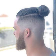The hair is shaved short enough to reveal the scalp completely on all sides. 12 Best Man Bun Fade Hairstyles Men S Hairstyles Haircuts