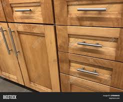 Sharp, contemporary design almost conceals this space's function as a kitchen. Wood Kitchen Cabinets Image Photo Free Trial Bigstock