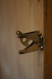 Once he built the bookcase and placed it between the hinges, he added locks and the pulleys that open the door when the book handle is pulled. Turn A Bookcase Into A Secret Door Your Projects Obn
