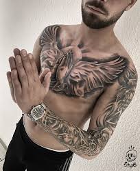 This is a one of the unique and attractive tattoo in our collection. Realistic Chest Tattoo For Men Holy Tattoo Praying Hands Wing Tattoo Tattoo Idea Men Stue524 Chest Tattoo Men Chest Tattoo Chest Tattoos For Women