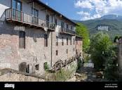 Demonte, Cuneo, Piedmont, italy: old houses along the river Stock ...